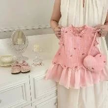 Vestido rosado con bolsito de corazón